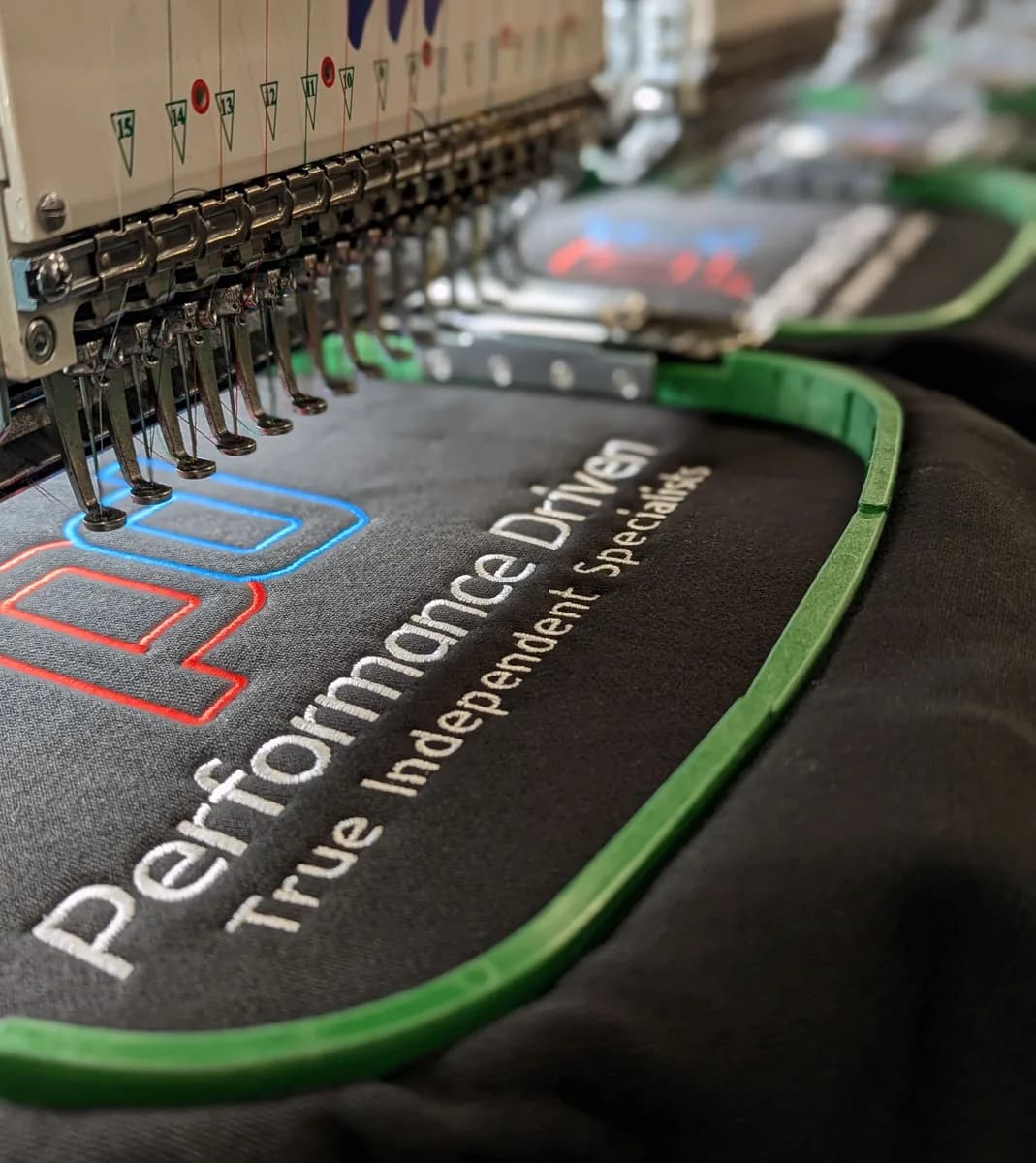 Custom embroidered workwear sample with company logo — embroidery services Watford